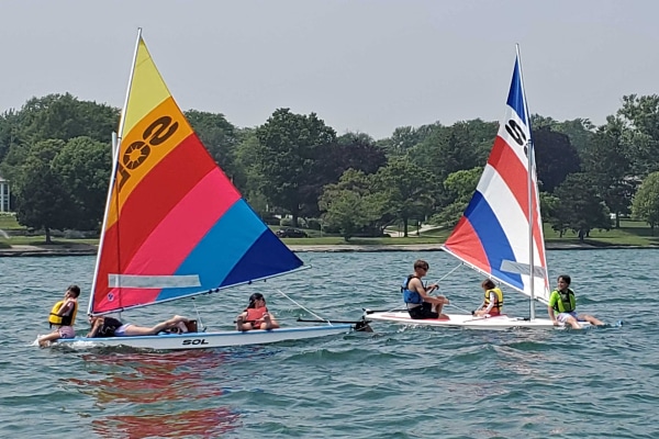 Two SOL Sailboats with brightly colored sails